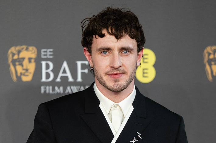 Man in formal black suit with white shirt at BAFTA Film Awards