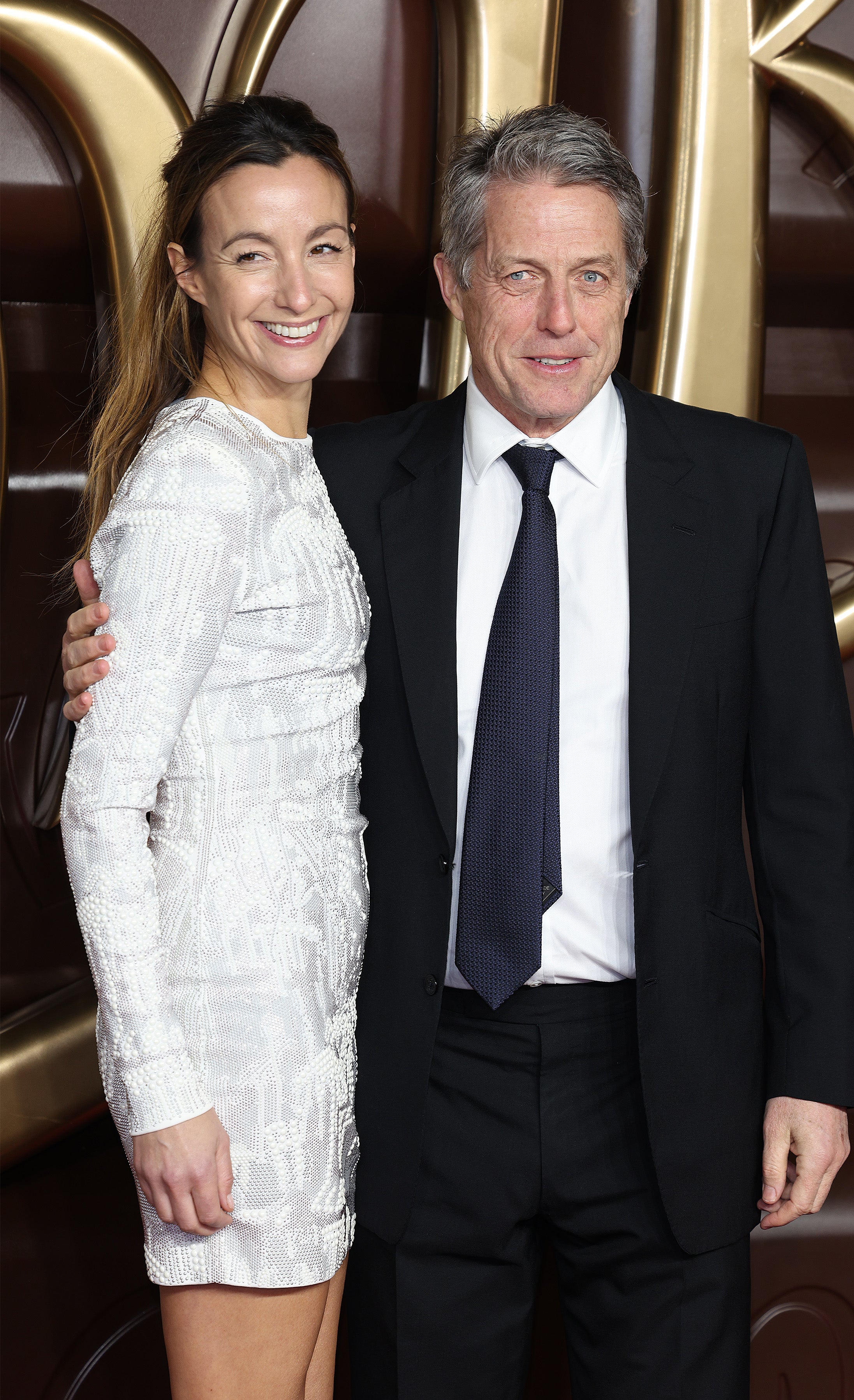 Hugh and his wife on the red carpet