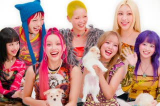 Group of stylishly dressed individuals smiling, some holding small dogs. They have unique hairstyles and colorful outfits, radiating joy and energy